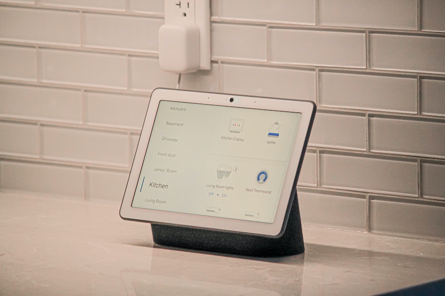 A tablet on a counter with a smart heating controls app