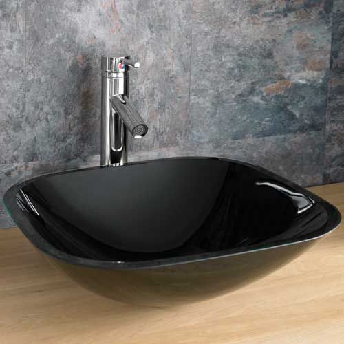 Black glass basin with a stainless steel tap.